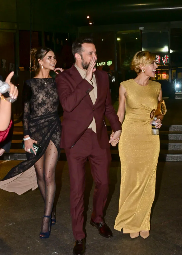 Sarah Wells, Noah Wyle, and Auden Wyle on the red carpet at The Pitt screening.