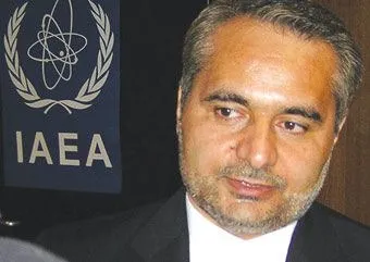 Seyed Hossein Mousavian, Iranian policymaker, in front of the IAEA logo.
