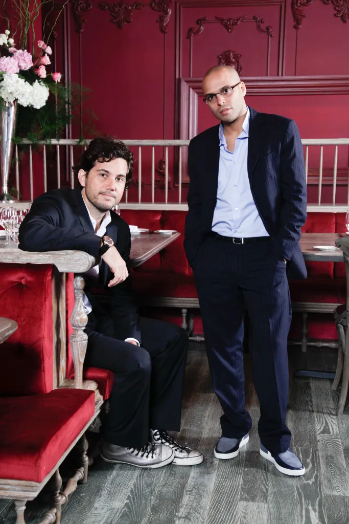 Richie Akiva and Scott Sartiano posing inside The Darby Restaurant.