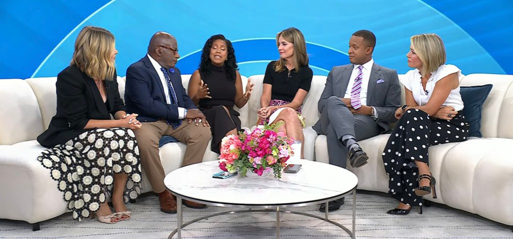 From left, Jenna Bush Hager, in a black blazer and black and white skirt, Al Roker, in a black blazer, black tie and khaki pants, Sheinelle Jones, in a burgundy dress, Savannah Guthrie, in a black top and red skirt, Craig Melvin, in a grey suit and red and white sriped tie, Dylan Dryer, in a white topped black and white skirt.