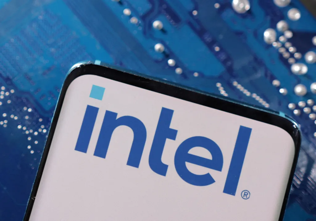 FILE PHOTO: A smartphone with an Intel logo displayed is placed on a computer motherboard in this illustration created on March 6, 2023. REUTERS/Dado Ruvic/Illustration/File Photo