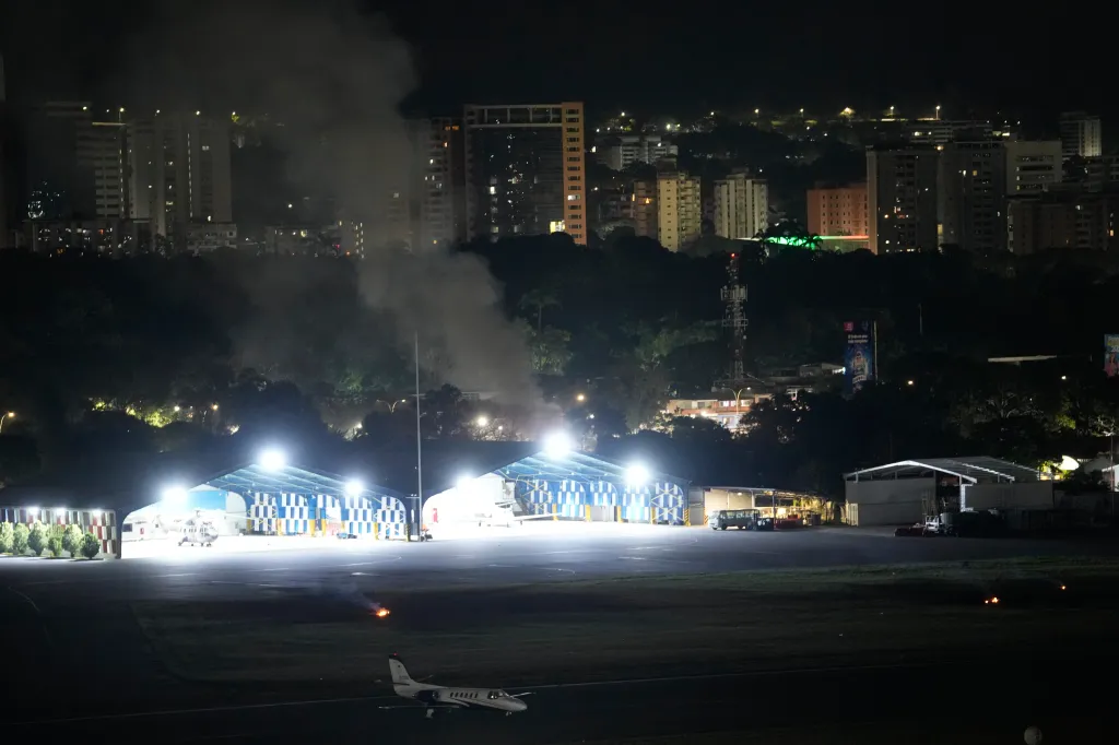 Smoke rises at La Carlota airport after a reported overnight explosion on Jan. 3, 2026.
