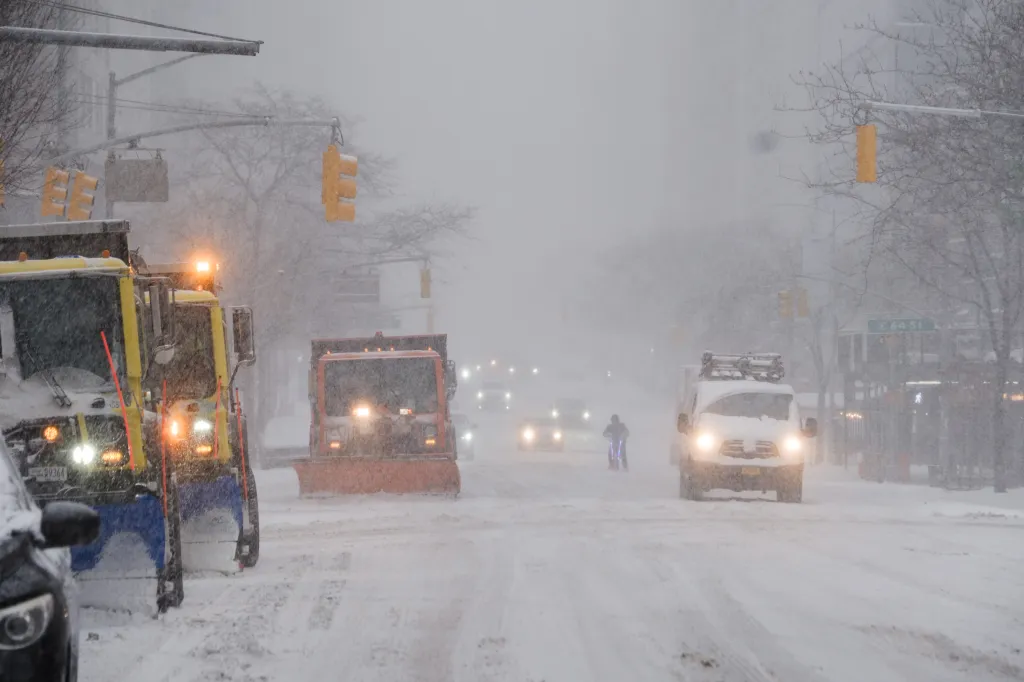 Snow plows clearing 2nd Avenue in Manhattan during the storm on Jan. 25, 2026.