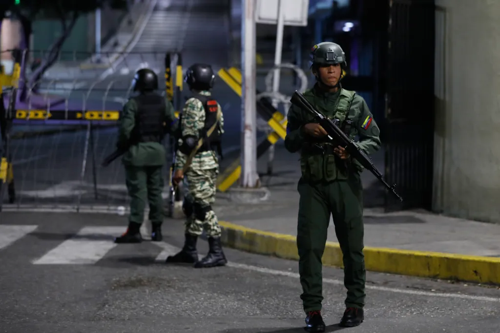 Soldiers guard the area around the Miraflores presidential palace after explosions and low-flying aircraft were heard in Caracas, Venezuela on Jan. 3, 2026.