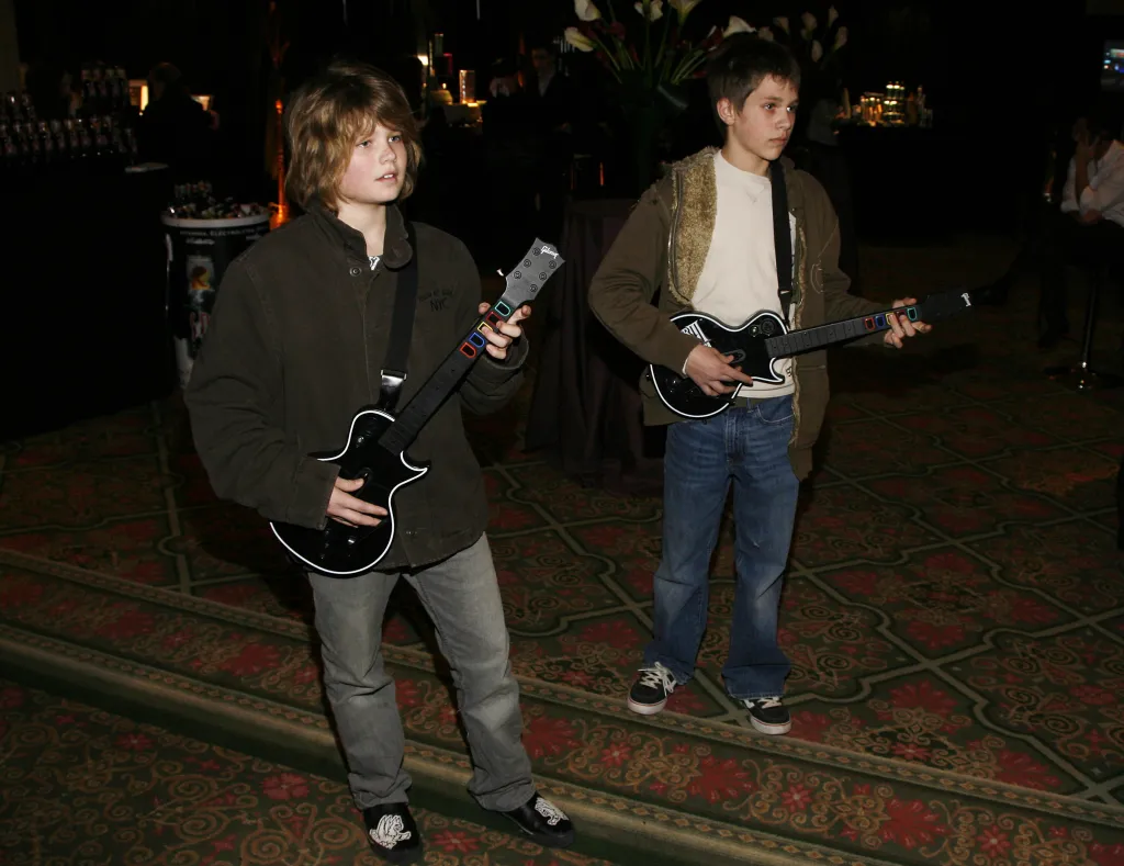 Speck Mellencamp and Hud Mellencamp playing Guitar Hero.