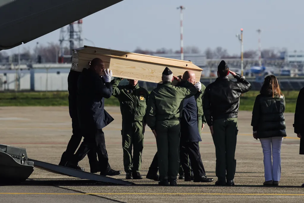 A coffin, carrying a victim of the deadly bar fire, is carried off a state plane at Milan Linate Airport in Milan, Italy, on Jan. 5, 2026.