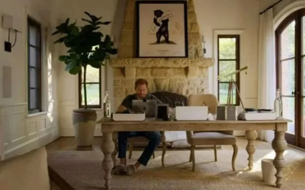 Prince Harry working at a desk in Meghan Markle and Prince Harry's Montecito mansion.