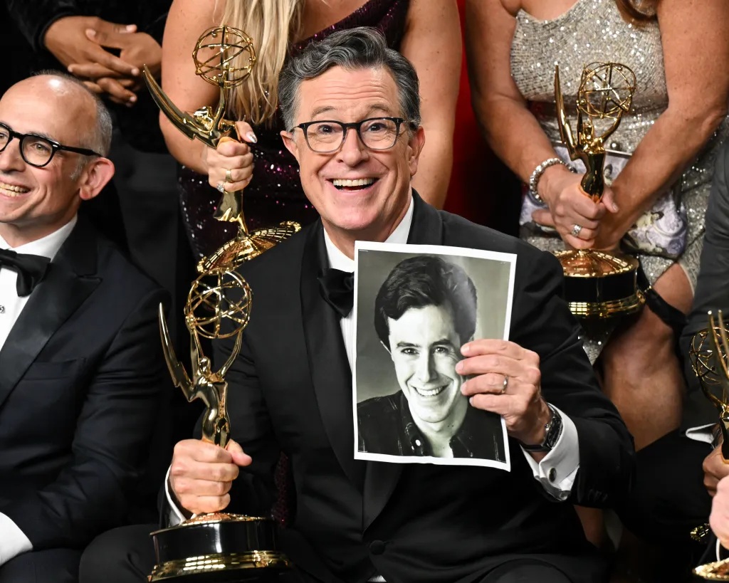 Stephen Colbert holds his Emmy Award after 