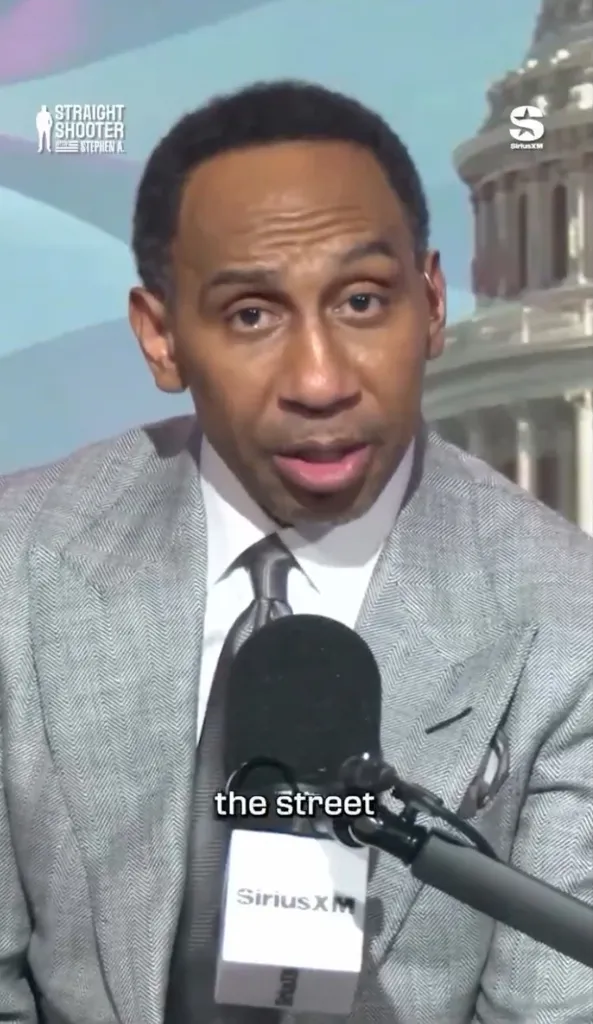Stephen A. Smith speaking into a SiriusXM microphone.