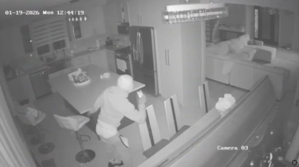 Surveillance video shows an unidentified suspect in a home during a home invasion robbery.