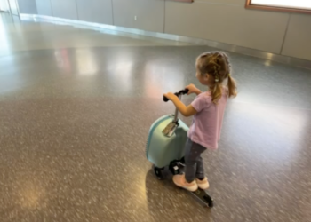 Kids are riding suitcases on wheels, and not everyone is amused