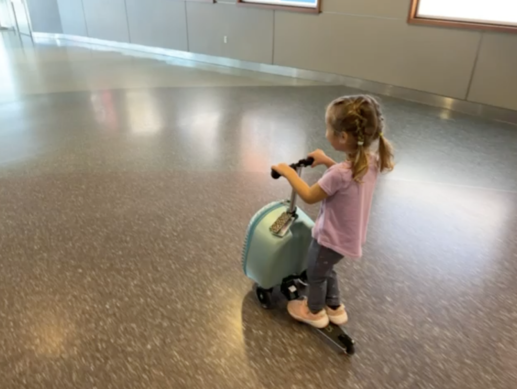 Kids are riding suitcases on wheels, and not everyone is amused