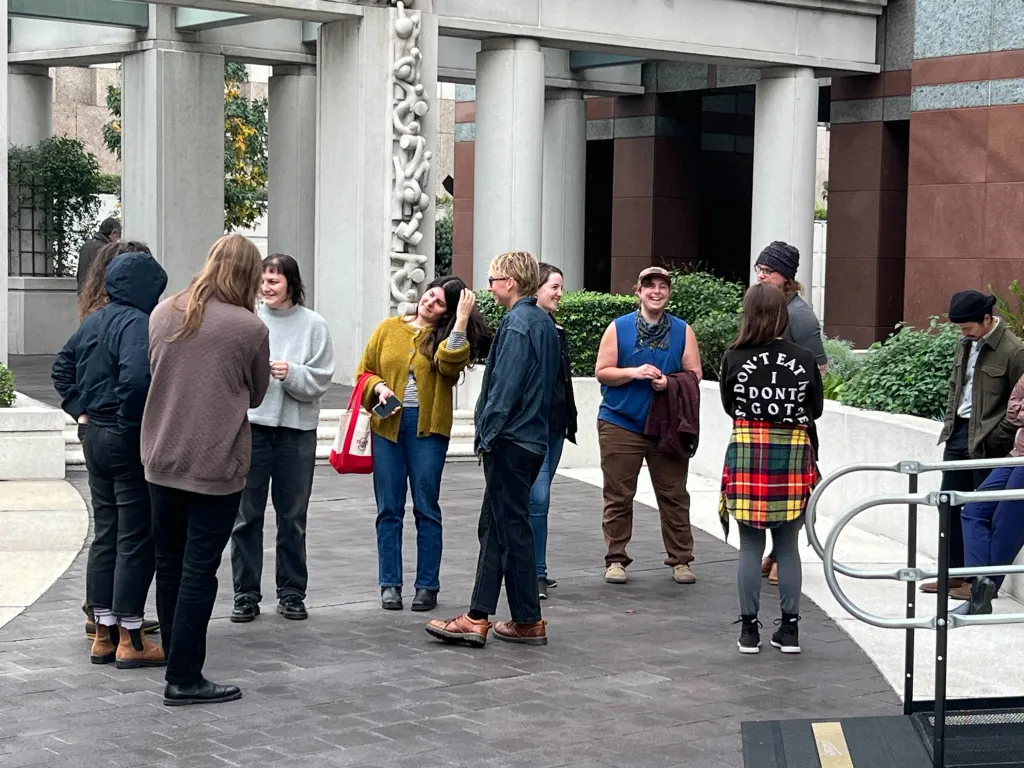 Terror suspect Tina Lai, charged in connection to an LA bomb plot, is supported by friends during a court hearing.