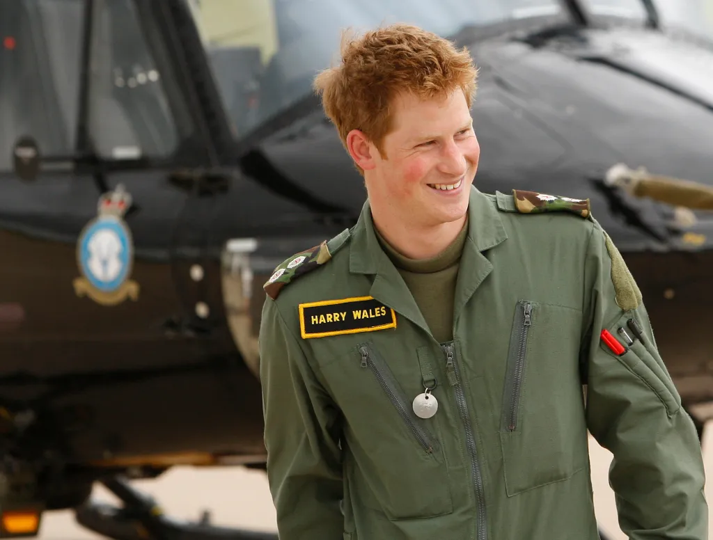 Prince Harry smiles during a photo call at Royal Air Force Shawbury in Shropshire, England, on June 18, 2009.