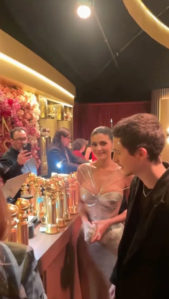 Kylie Jenner and Timothée Chalamet at the Golden Globes engraving station.