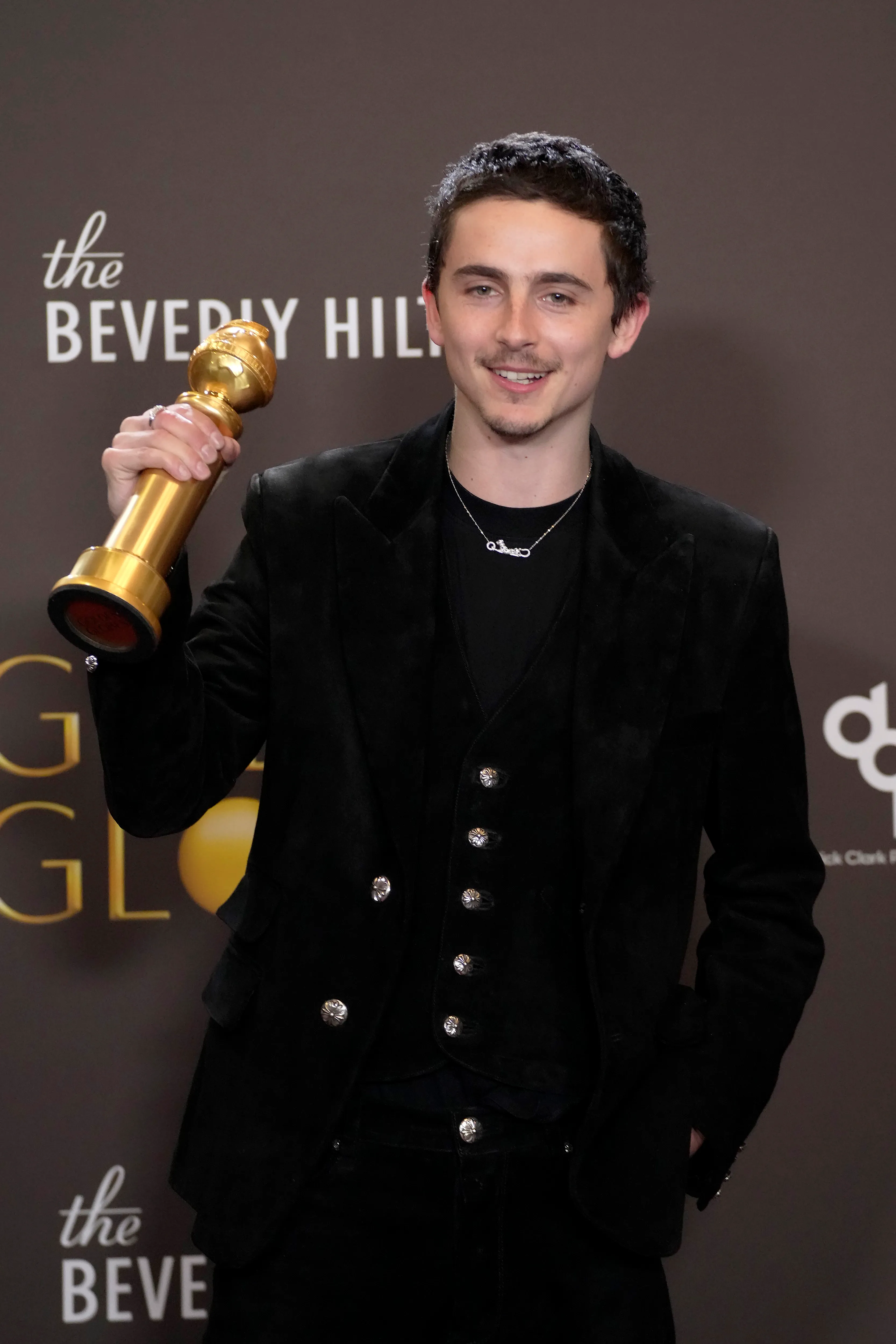 Timothee Chalamet with his Golden Globe for 