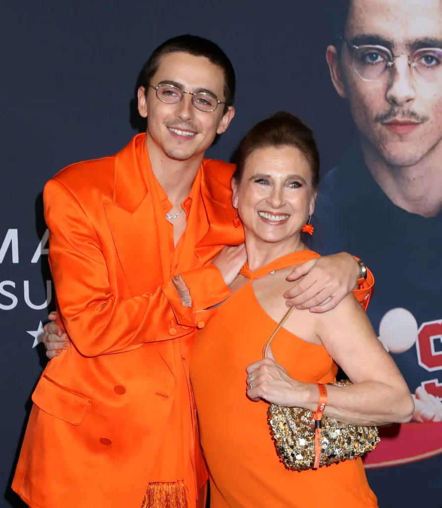 Timothée Chalamet and Nicole Flender smiling together.