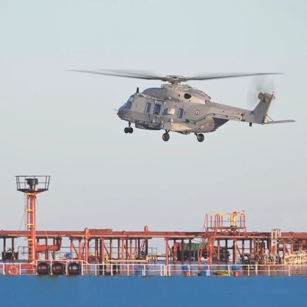 A French Navy helicopter flies over the seized oil tanker on Jan. 22, 2026.