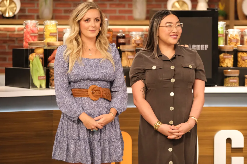 Kelsey Barnard Clark and Nini Nguyen standing side-by-side in front of a counter with various cooking ingredients.
