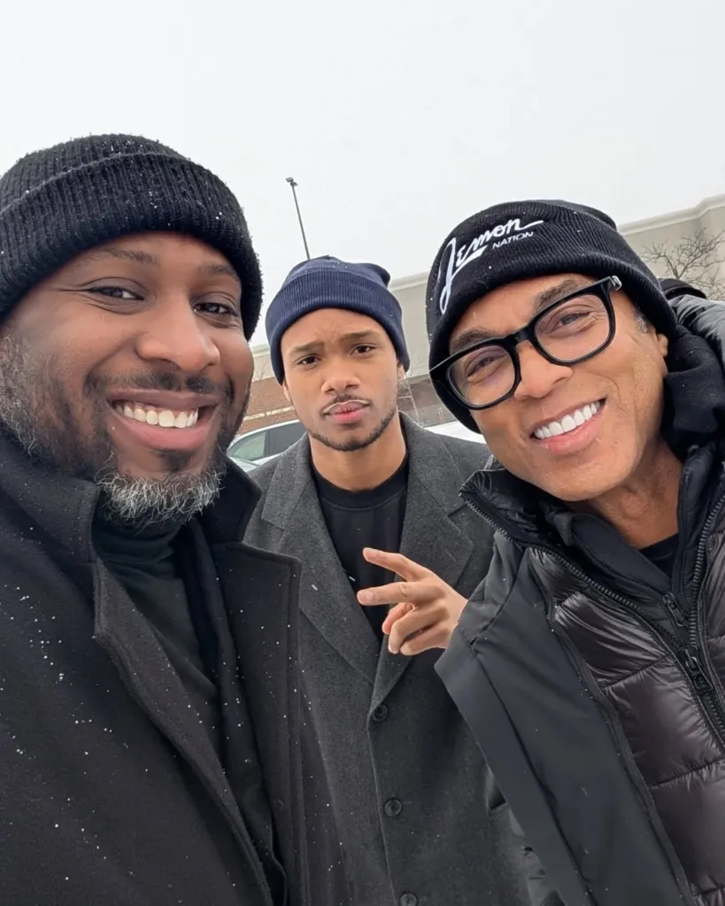 Don Lemon poses with protesters outside the St. Paul church.