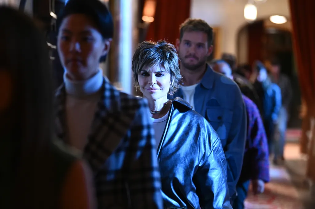 Lisa Rinna, Kristen Kish, and Colton Underwood standing in line on The Traitors.