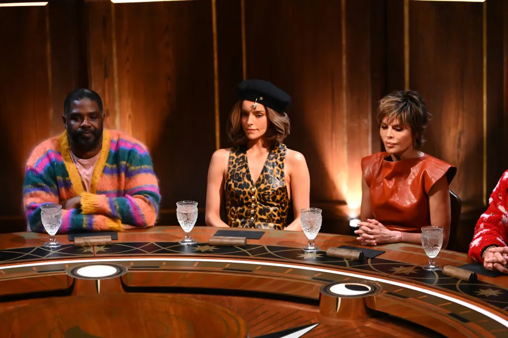 Ron Funches, Maura Higgins, and Lisa Rinna sit at a table on