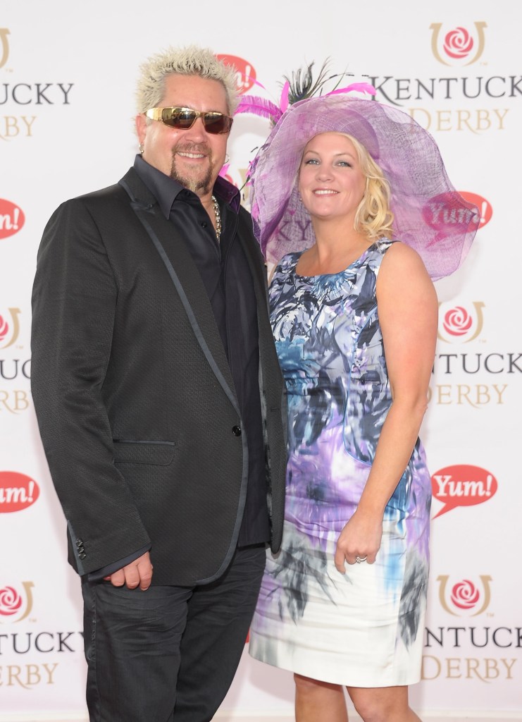 Guy Fieri and his wife Lori Fieri pose at the Kentucky Derby.
