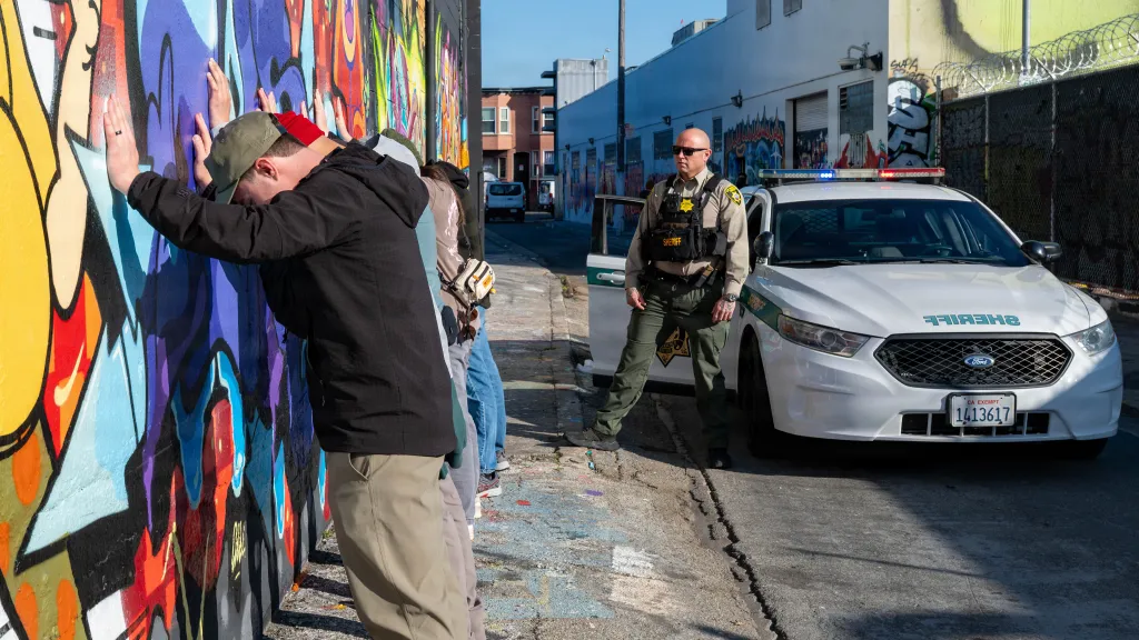 Airmen simulating being arrested during Exercise Sourdough.