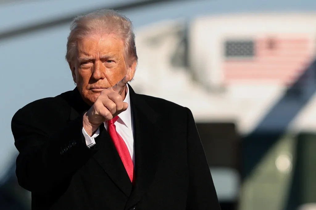 U.S. President Donald Trump gestures before boarding Air Force One.