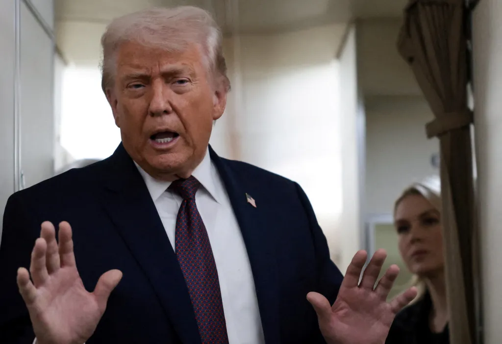 President Donald Trump speaks to reporters on board Air Force One during the return flight to Washington, DC, after attending the World Economic Forum in Davos, Switzerland, on Jan. 22, 2026.