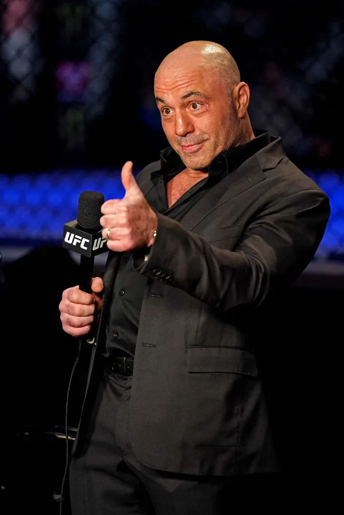 UFC ringside announcer Joe Rogan giving a thumbs-up during UFC 261.