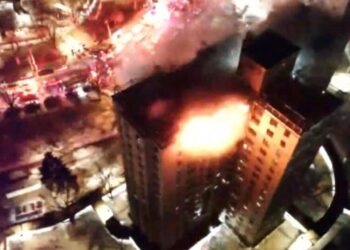 Gas explosion and fire on top floors of New York City apartment building kills 1, injures 14