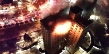 Gas explosion and fire on top floors of New York City apartment building kills 1, injures 14