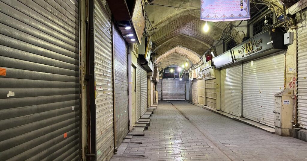 Security forces clash with protesters in Iran’s main market as at least 35 killed in demonstrations