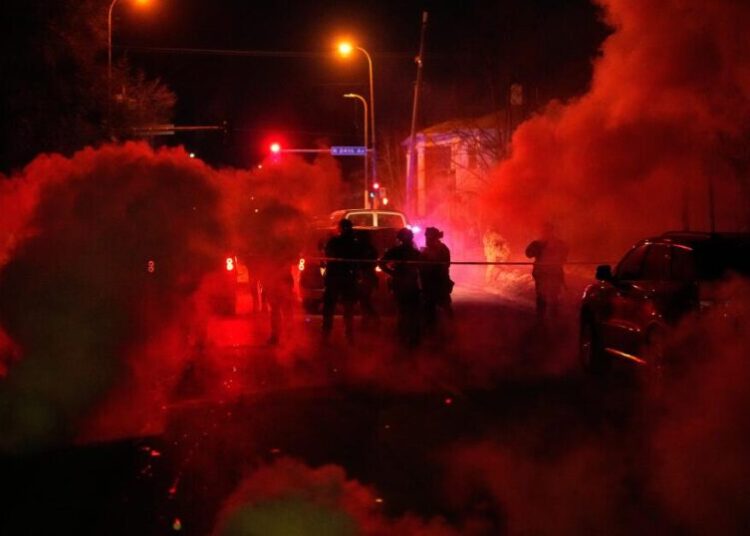 Tear gas floods a Minneapolis family’s SUV after they get caught between protesters and officers