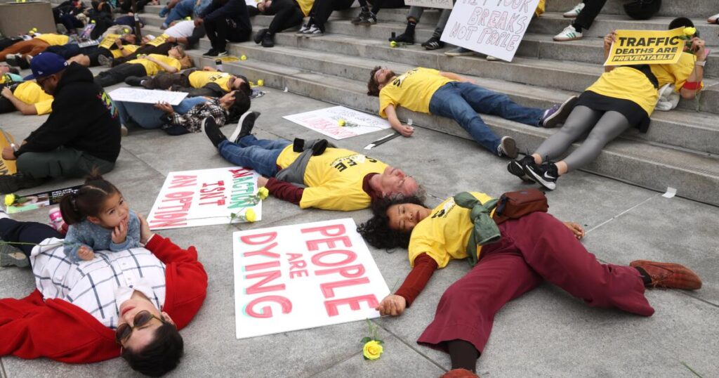 Dozens ‘die’ at L.A. City Hall to protest 290 traffic-related deaths in the city in 2025
