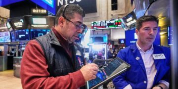 Stocks rise as gold hits another record and the dollar’s value sinks again