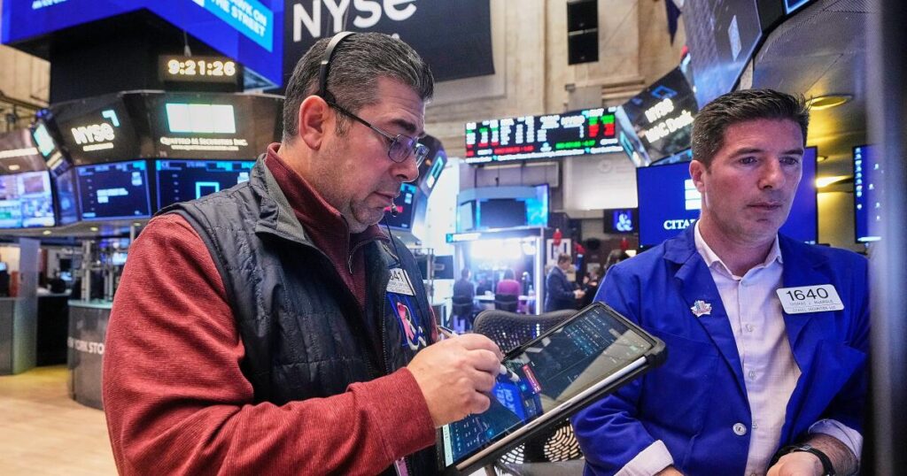 Stocks rise as gold hits another record and the dollar’s value sinks again