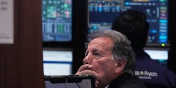 Wall Street ticks to records after shaking off worries about Trump’s feud with the Fed