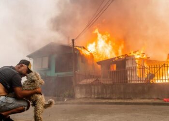 Wildfires race across Chile, leaving 18 dead and forcing 50,000 to flee