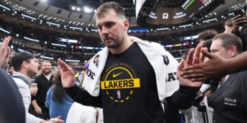Lakers star Luka Doncic injures left leg after slipping off the court in Cleveland