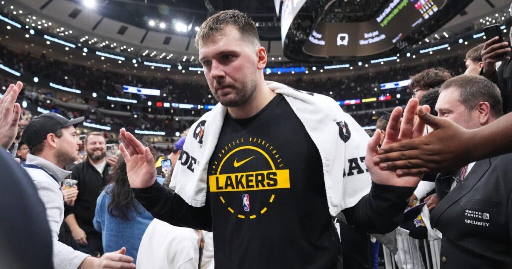 Lakers star Luka Doncic injures left leg after slipping off the court in Cleveland