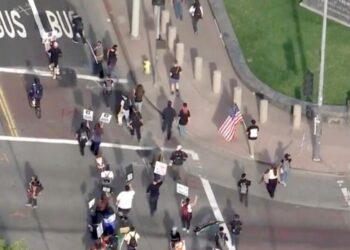 Anti-Trump protesters join ‘Free America’ walkout in downtown L.A. and across SoCal
