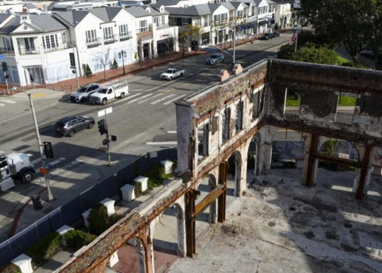 ‘If we open, we have to start over from scratch.’ Businesses still stuck a year after the L.A. fires