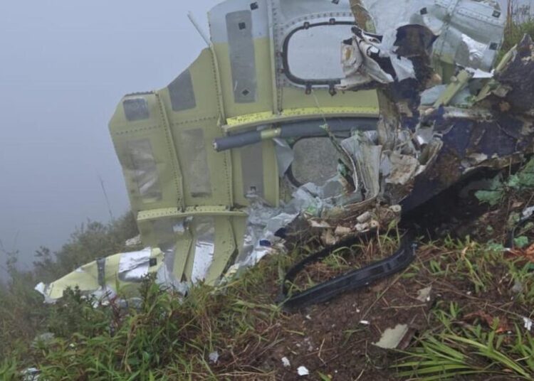 Indonesian rescuers find a body near wreckage of a plane that crashed with 11 aboard