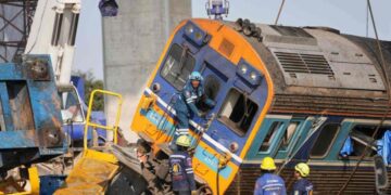 A construction crane falls onto a moving train in Thailand, killing at least 32 people