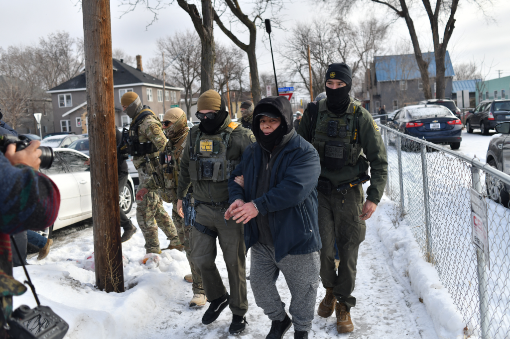 US Customs and Border Protection agents arresting a man in Minneapolis.