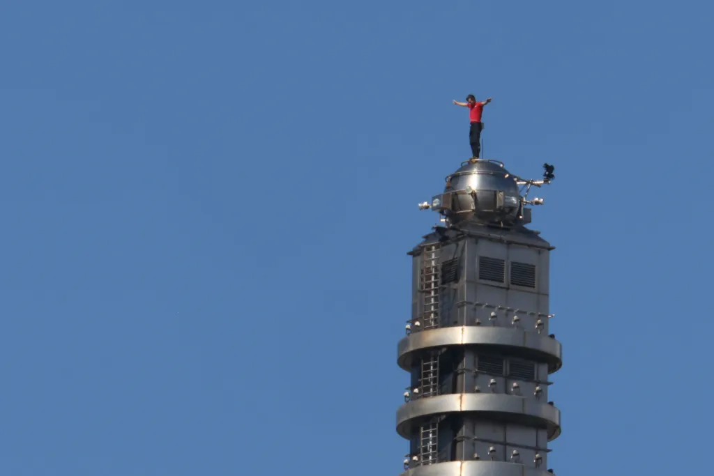US rock climber Alex Honnold reacts upon reaching the top of the Taipei 101 skyscraper building, in Taipei, Taiwan, on January 25, 2026.
