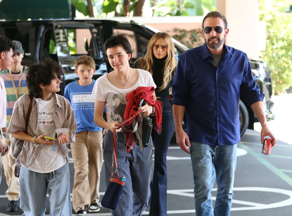 Jennifer Lopez, Ben Affleck, and their children, Seraphina Affleck, Samuel Affleck, Emme Anthony, and Max Anthony, walk together outside the Beverly Hills Hotel.