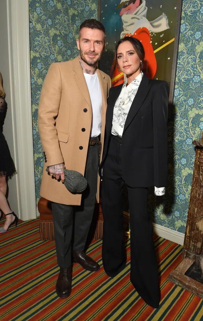 Victoria and David Beckham posing together at the Victoria Beckham x YouTube Fashion & Beauty After Party at London Fashion Week.